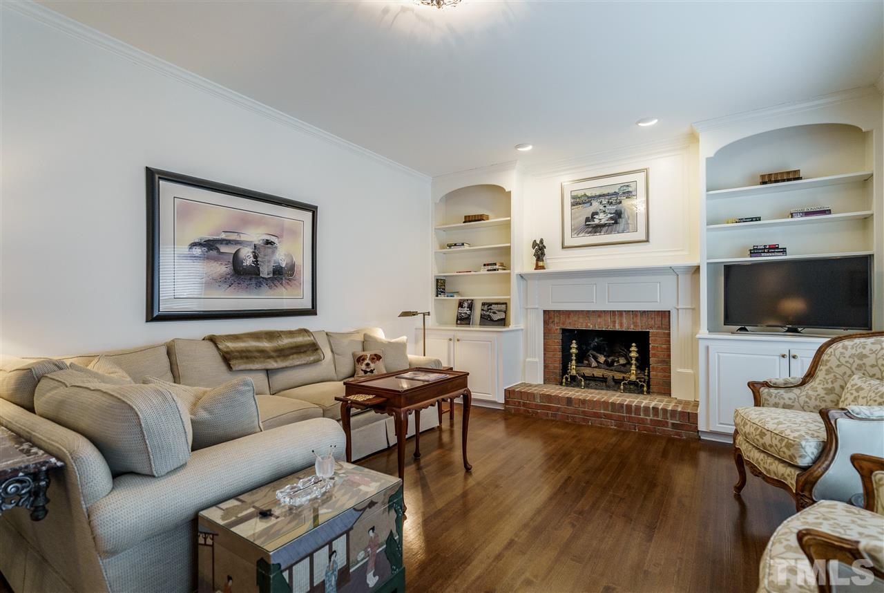 8509 Riddle Place Raleigh, NC 27615 - Photo 17 of 30 a living room with furniture and a fireplace