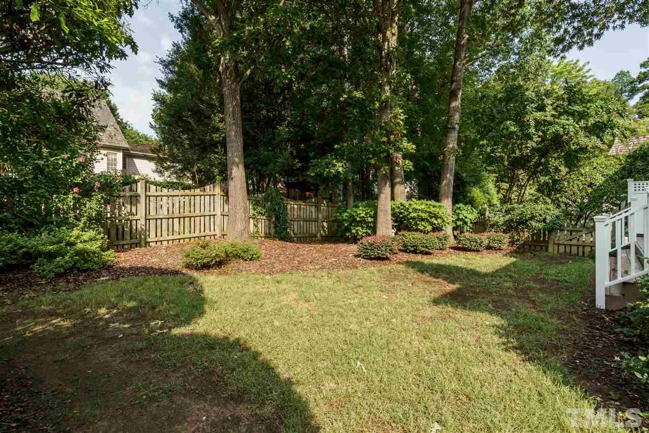 8509 Riddle Place Raleigh, NC 27615 - Photo 29 of 30 a view of a yard with plants and tree