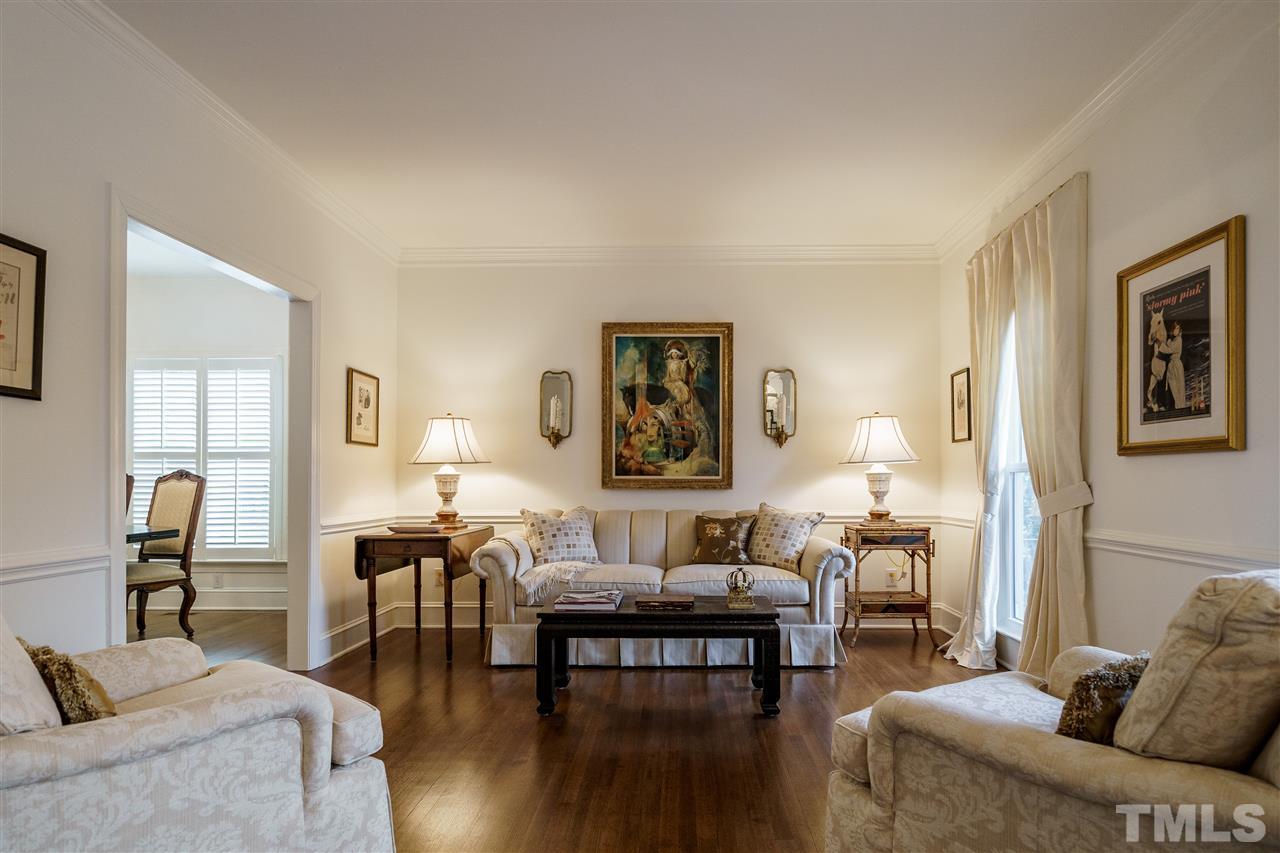 8509 Riddle Place Raleigh, NC 27615 - Photo 4 of 30 a living room with furniture and wooden floor