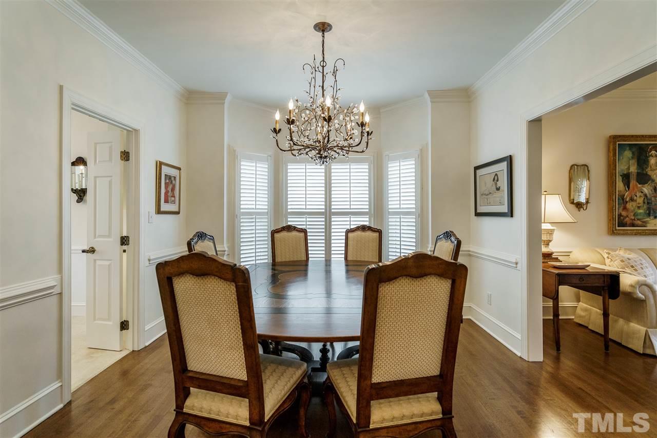 8509 Riddle Place Raleigh, NC 27615 - Photo 5 of 30 a view of a dining room with furniture window and wooden floor