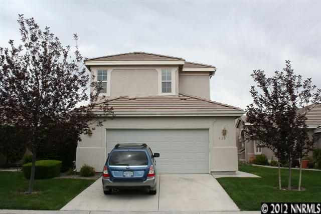 1133 Scenic Park Terrace Reno, NV 89521 - Photo 1 of 1 a car parked in front of a house