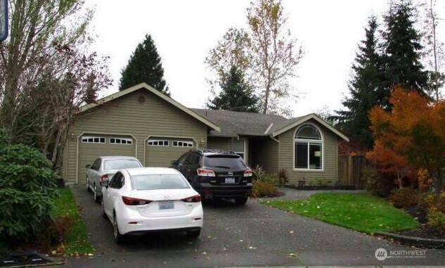 23406 9th Place West Bothell, WA 98021 - Photo 1 of 1 a car parked in front of a house