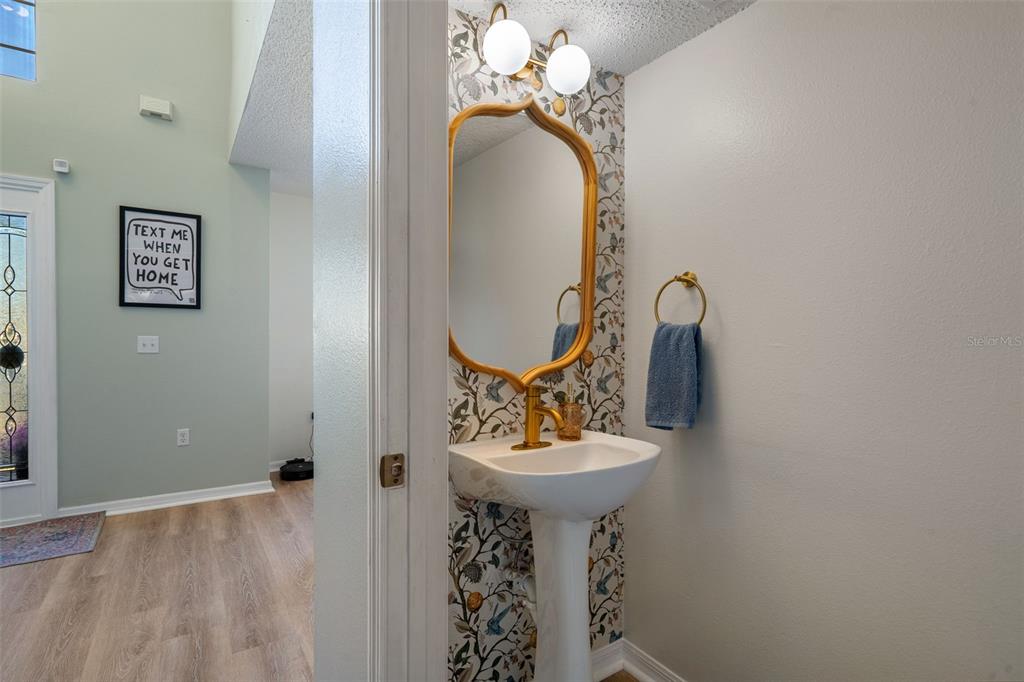 11258 Lomita Wren Road Weeki Wachee, FL 34614 - Photo 11 of 44 a bathroom with a sink and mirror