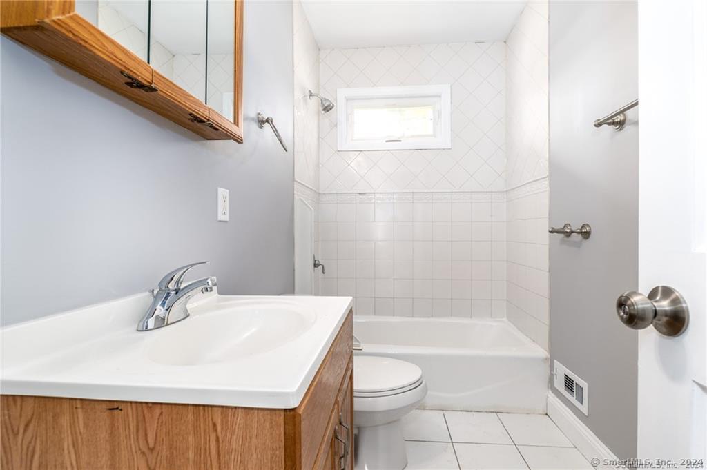 29 Dolsen Place, Unit 2 Stamford, CT 06901 - Photo 14 of 18 a bathroom with a sink toilet and shower