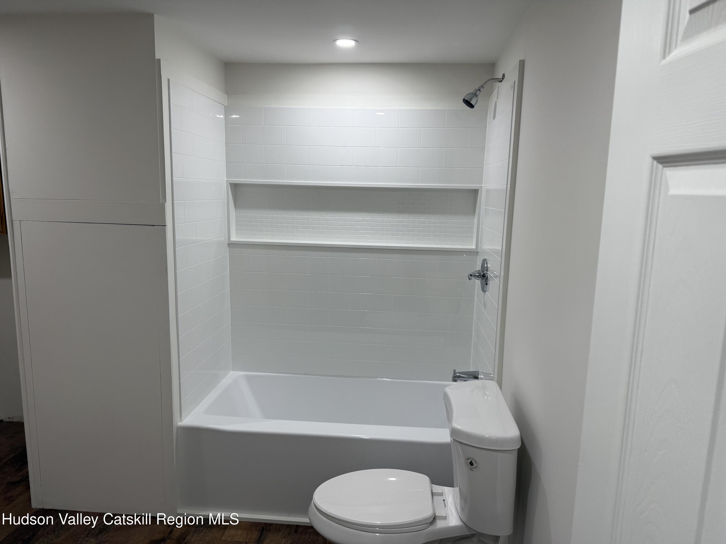 31 Bell Way Monticello, NY 12701 - Photo 13 of 15 a bathroom with a toilet and bathtub