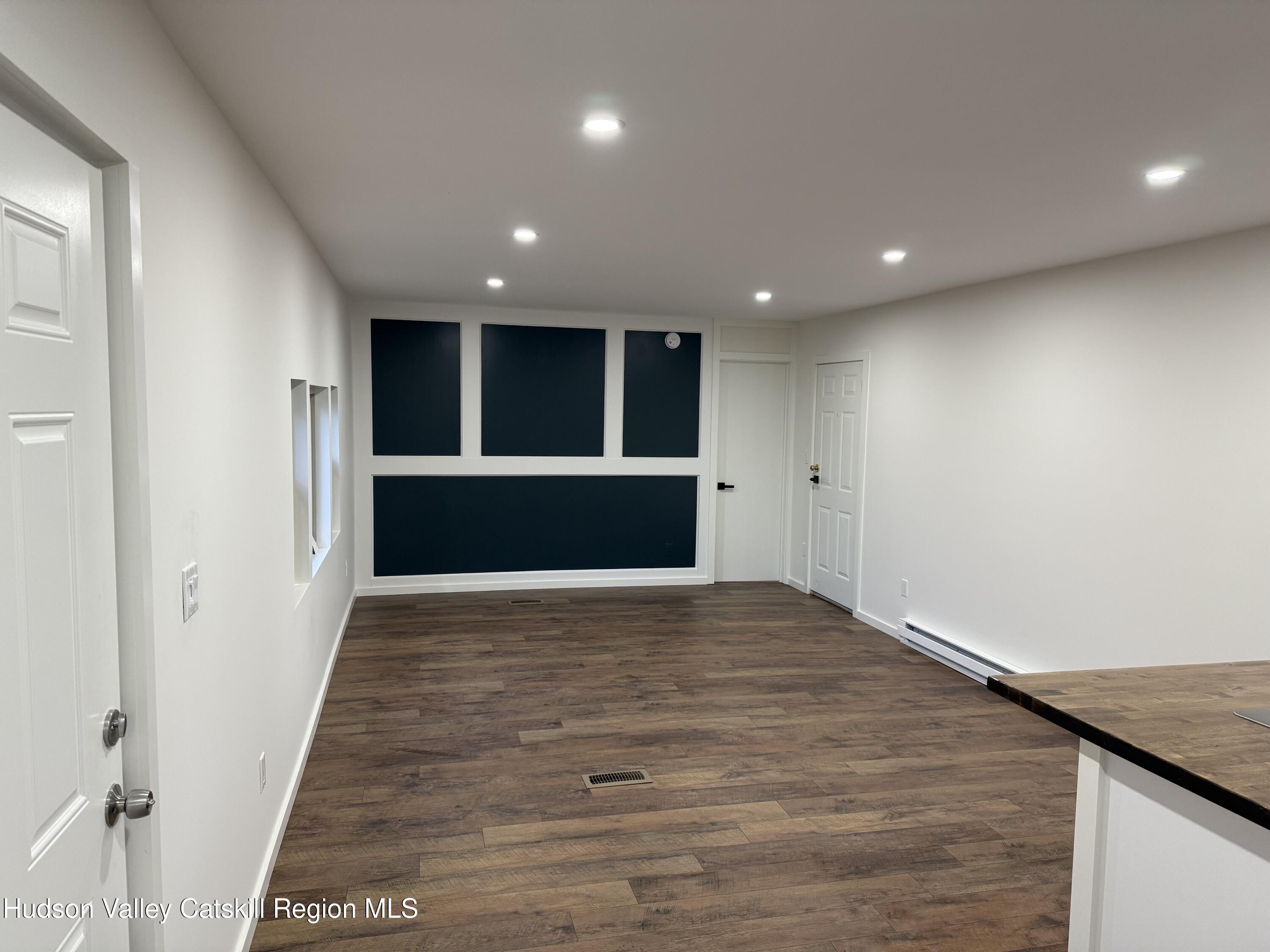 31 Bell Way Monticello, NY 12701 - Photo 4 of 15 a view of empty room with wooden floor