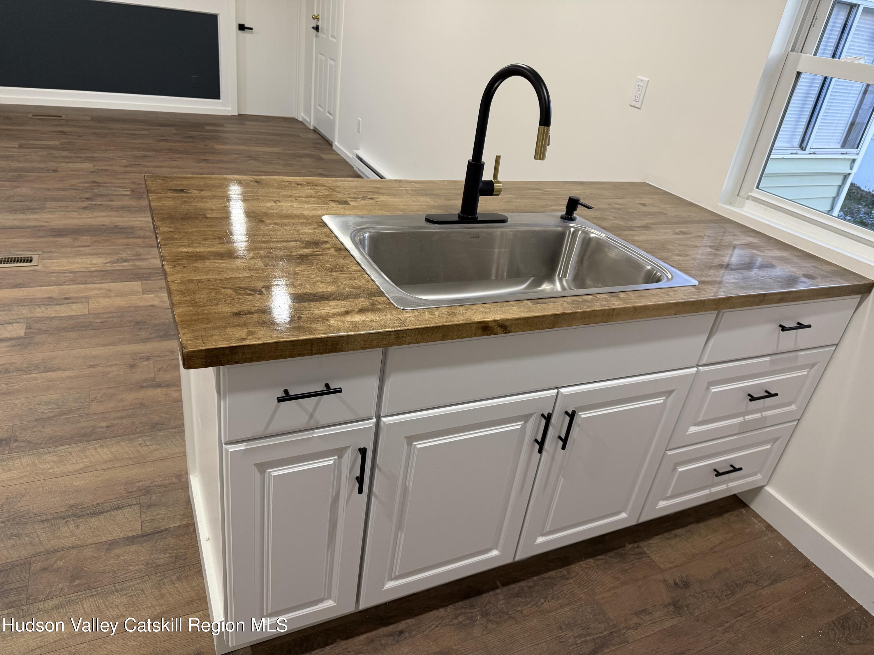 31 Bell Way Monticello, NY 12701 - Photo 8 of 15 a kitchen with sink and cabinets