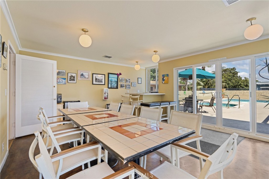 1 3rd Place, Unit 2 Long Beach, CA 90802 - Photo 22 of 40 a view of a dining room with furniture wooden floor and chandelier