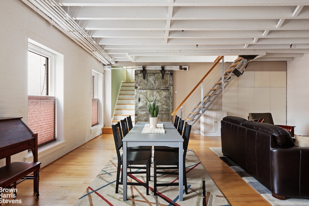 1 Worth Street, Unit 6R Manhattan, NY 10013 - Photo 4 of 17 a dining room with furniture and wooden floor