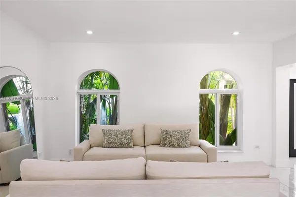 a large bed sitting in a bedroom and lamp