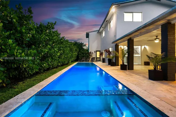 a view of swimming pool with outdoor seating