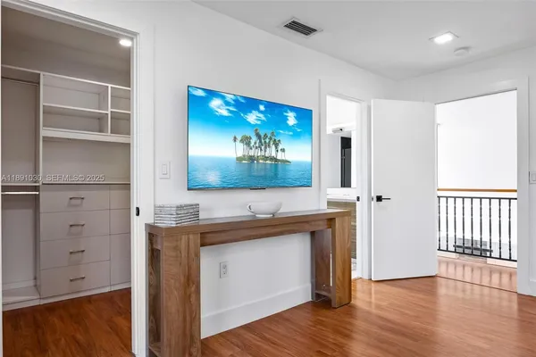 a bedroom with a bed and a table