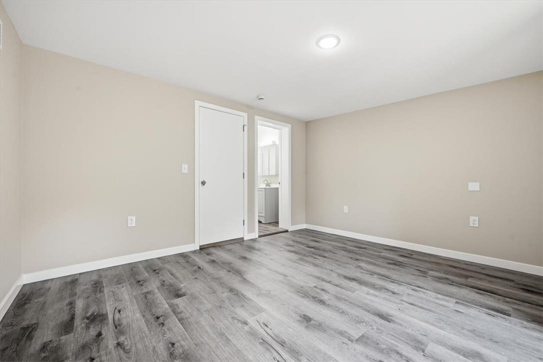 5641 North Coplay Road Whitehall, PA 18052 - Photo 26 of 68 Newly updated flooring complements the neutral walls, creating a clean and versatile living area.