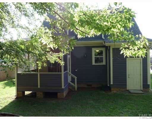 310 Cooke Street Raleigh, NC 27601 - Photo 12 of 12 a wooden fence and a bench in a backyard
