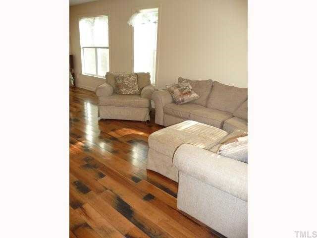 310 Cooke Street Raleigh, NC 27601 - Photo 3 of 12 a living room with furniture and a window