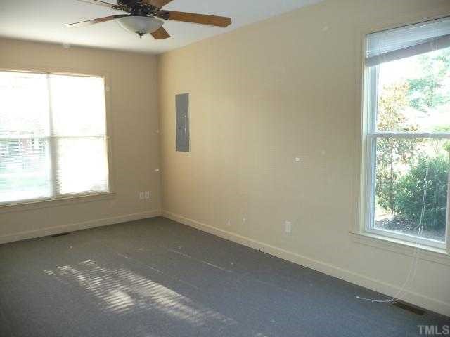 310 Cooke Street Raleigh, NC 27601 - Photo 7 of 12 a view of an empty room with a window