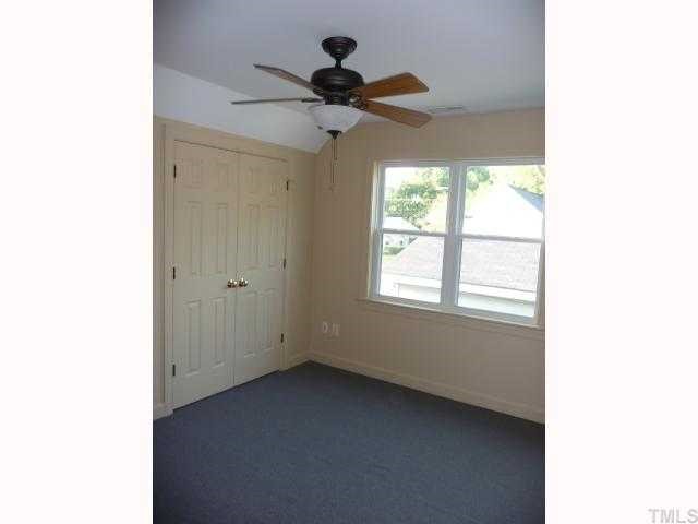 310 Cooke Street Raleigh, NC 27601 - Photo 9 of 12 a view of a livingroom with a ceiling fan and window