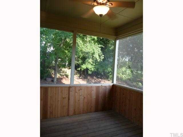 310 Cooke Street Raleigh, NC 27601 - Photo 10 of 12 a view of a room with wooden floor and windows