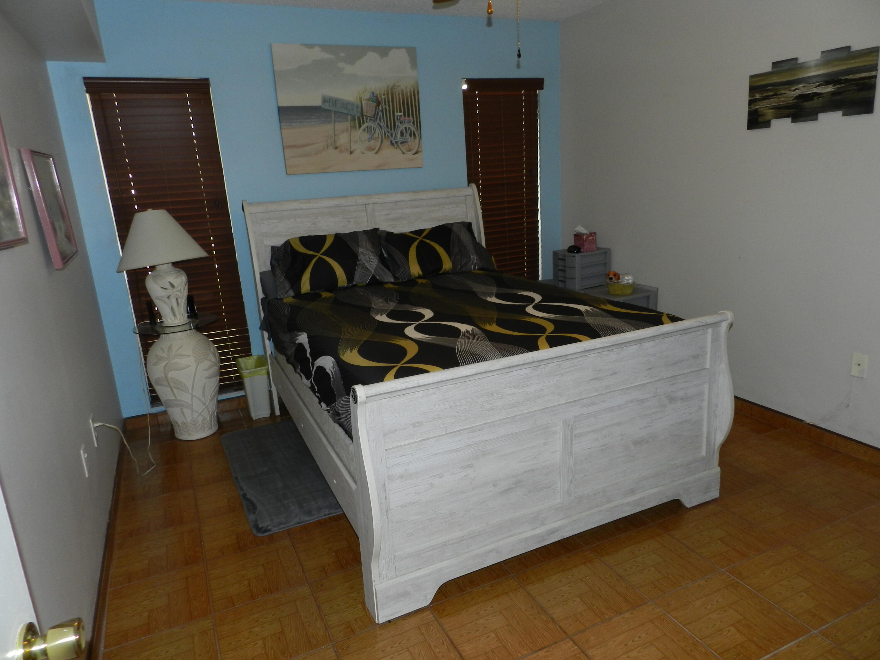 7 Greenway Village North, Unit 103 Royal Palm Beach, FL 33411 - Photo 12 of 29 a living room with furniture