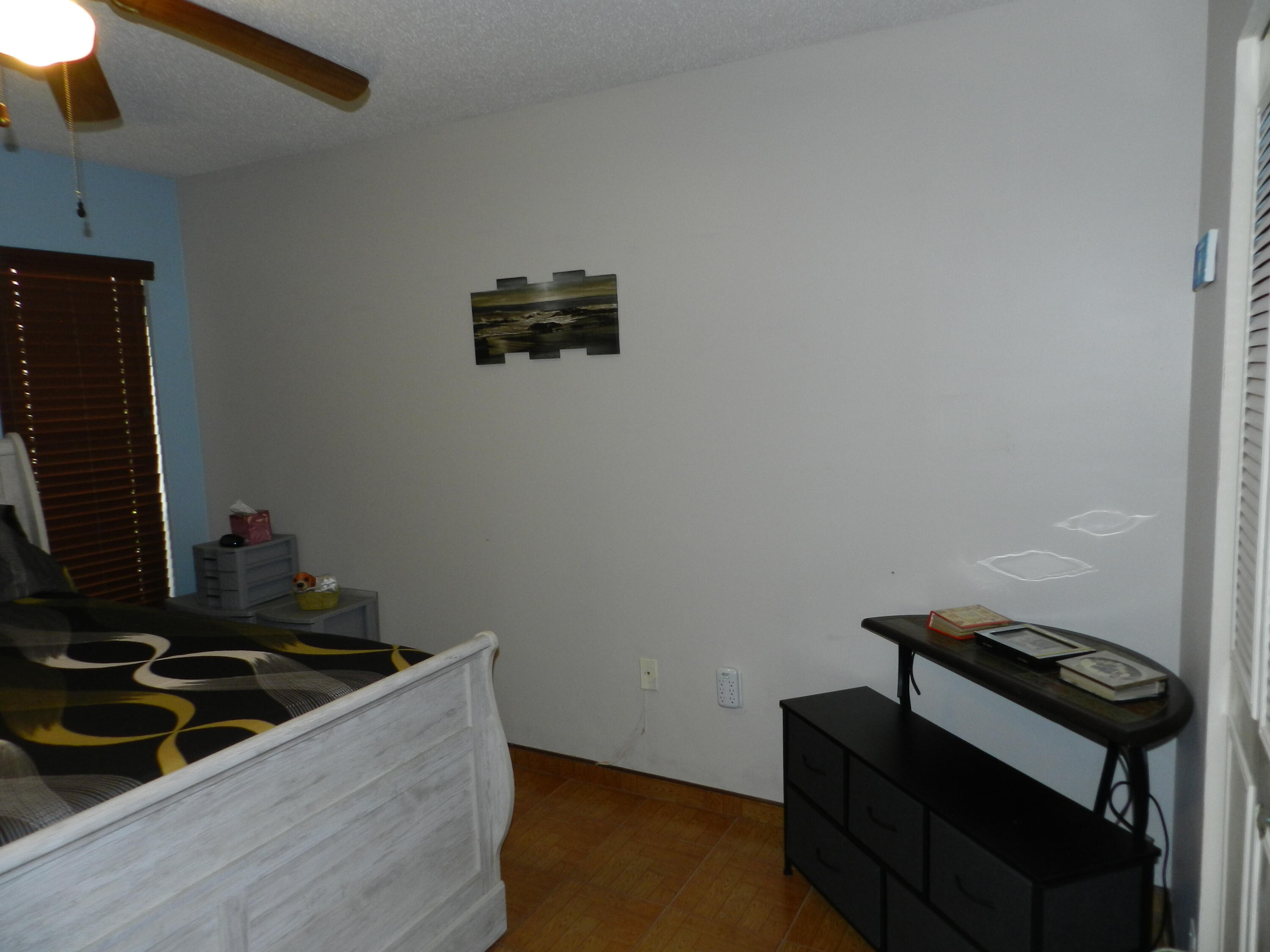 7 Greenway Village North, Unit 103 Royal Palm Beach, FL 33411 - Photo 14 of 29 a room with furniture