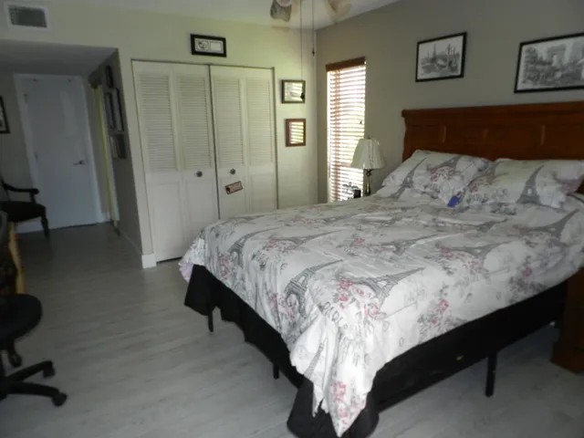 a bedroom with a bed and a table in it