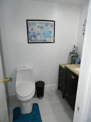 a bathroom with a toilet and a sink