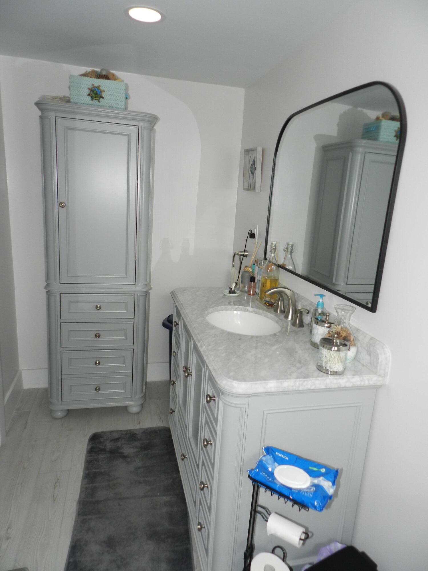 7 Greenway Village North, Unit 103 Royal Palm Beach, FL 33411 - Photo 25 of 29 a bathroom with a sink a vanity and a mirror