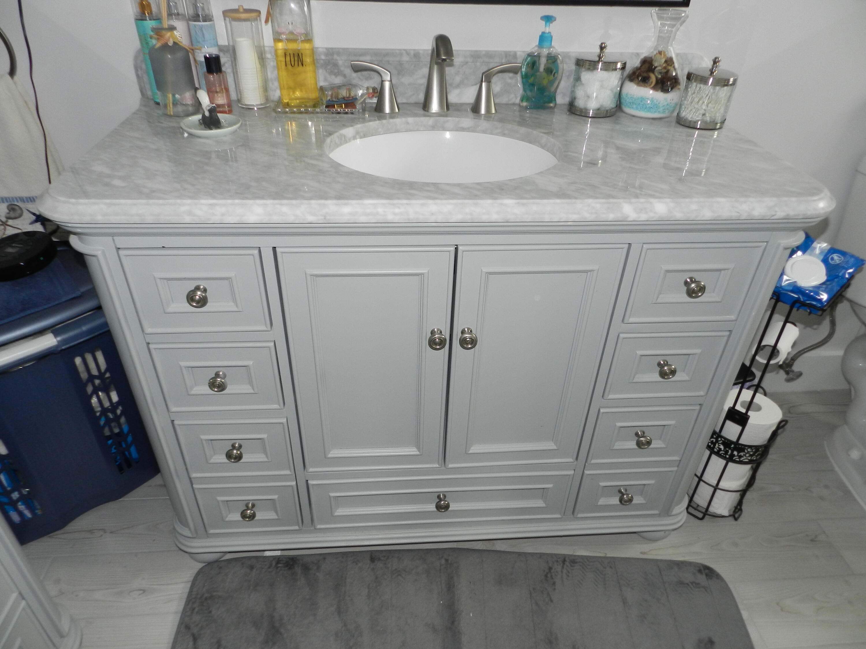 7 Greenway Village North, Unit 103 Royal Palm Beach, FL 33411 - Photo 26 of 29 a bathroom with a sink and a mirror