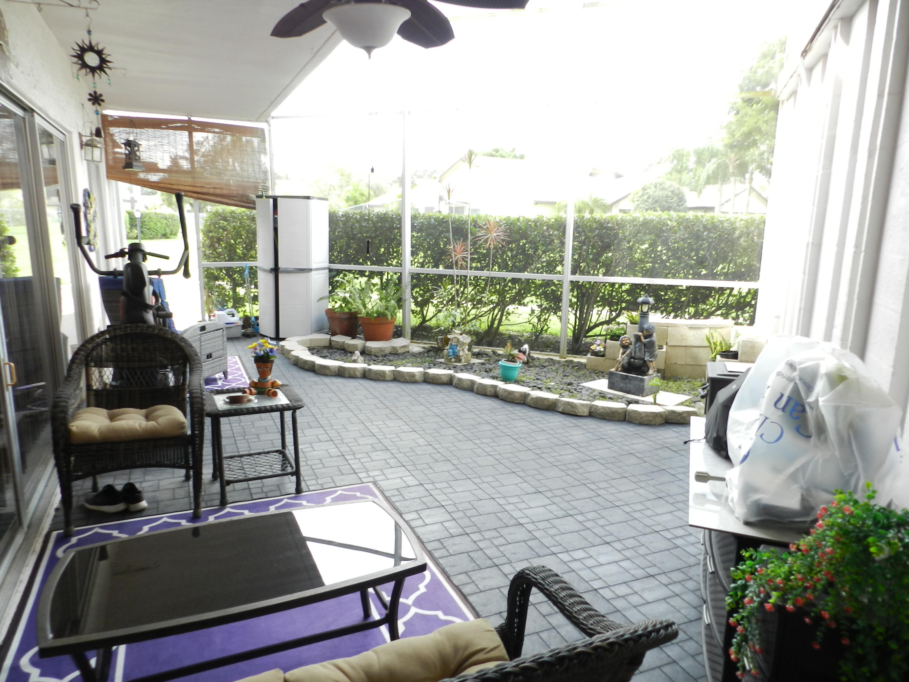 7 Greenway Village North, Unit 103 Royal Palm Beach, FL 33411 - Photo 27 of 29 a living room with furniture