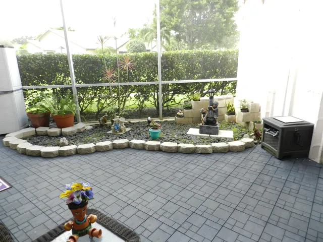 a view of a sink and dining area with furniture
