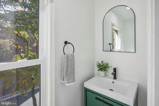 a close view of a sink and a mirror in a bathroom
