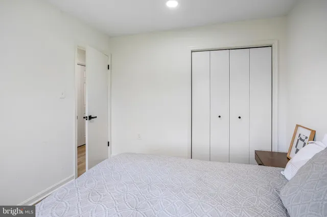 a bedroom with a bed and a closet