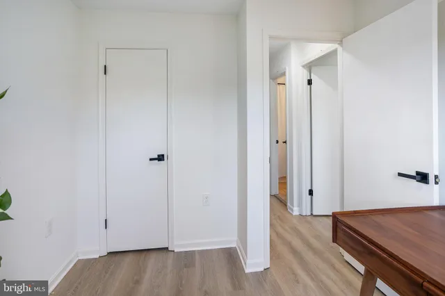 a view of room with wooden floor