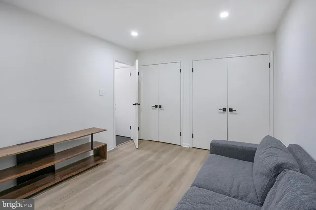 a view of a livingroom with furniture and a window