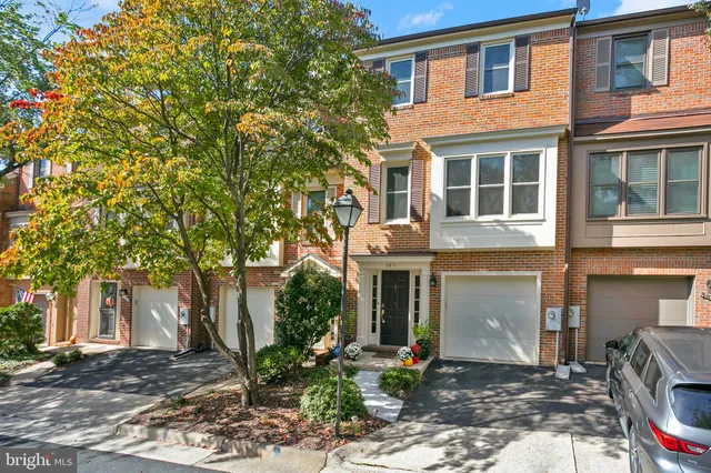 a city street lined with buildings and trees