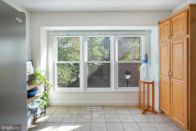 a view of an entryway with flower pots