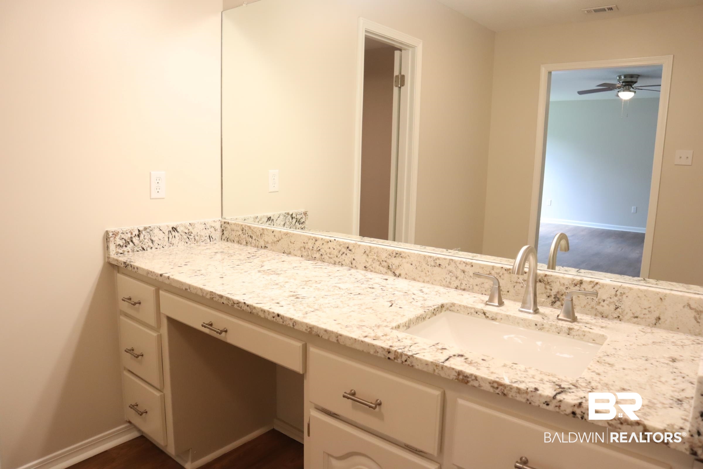 12150 Lee Bishop Road Irvington, AL 36544 - Photo 17 of 26 Bathroom featuring ceiling fan, visible vents, baseboards, and vanity