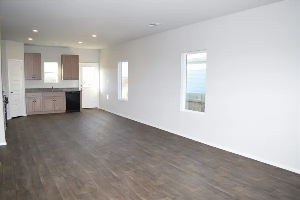 a view of yard with swimming pool and green space