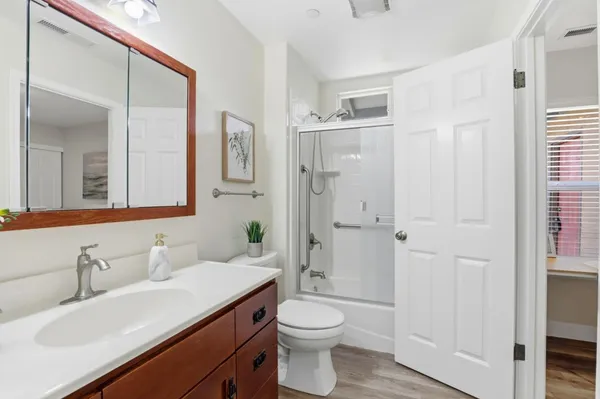 a spacious bedroom with a bed and a window