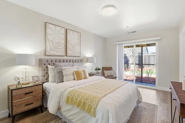 a bedroom with a bed and a table