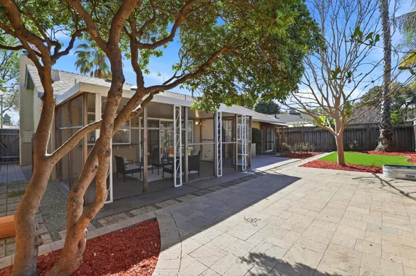 a view of a house with a yard porch and sitting area