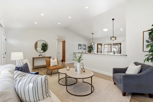 a living room with furniture and a table