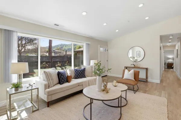 a living room with furniture and a large window