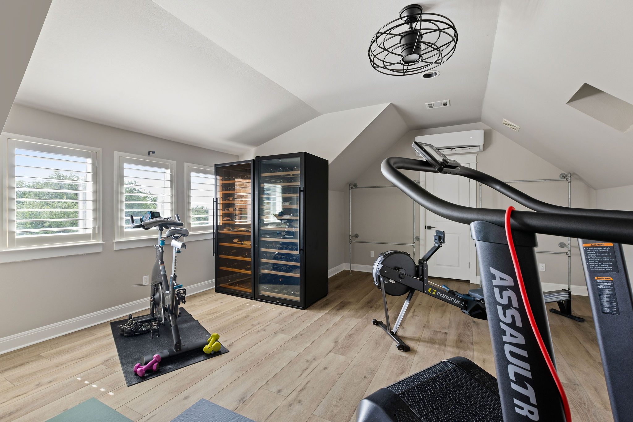 279 Rugged Earth Drive Austin, TX 78737 - Photo 32 of 39 Achieve peak performance in this well-equipped fitness space with ample natural light.