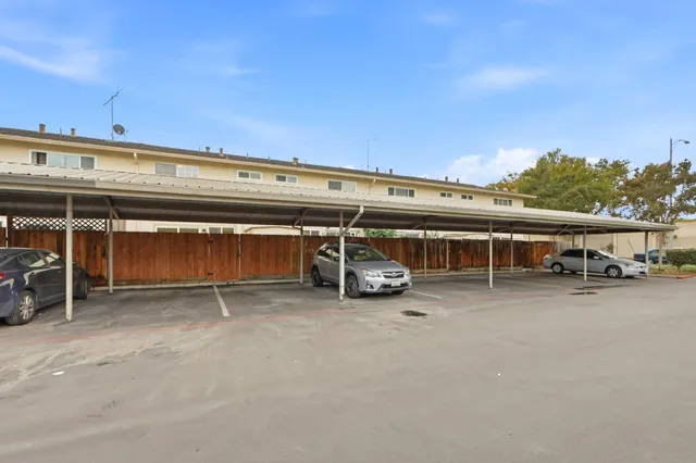 an empty room with furniture and a car