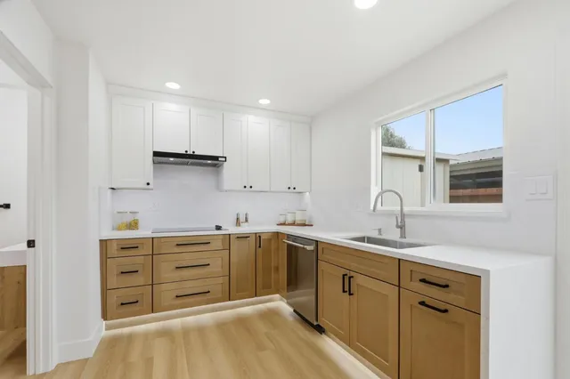 a kitchen with a sink and cabinets