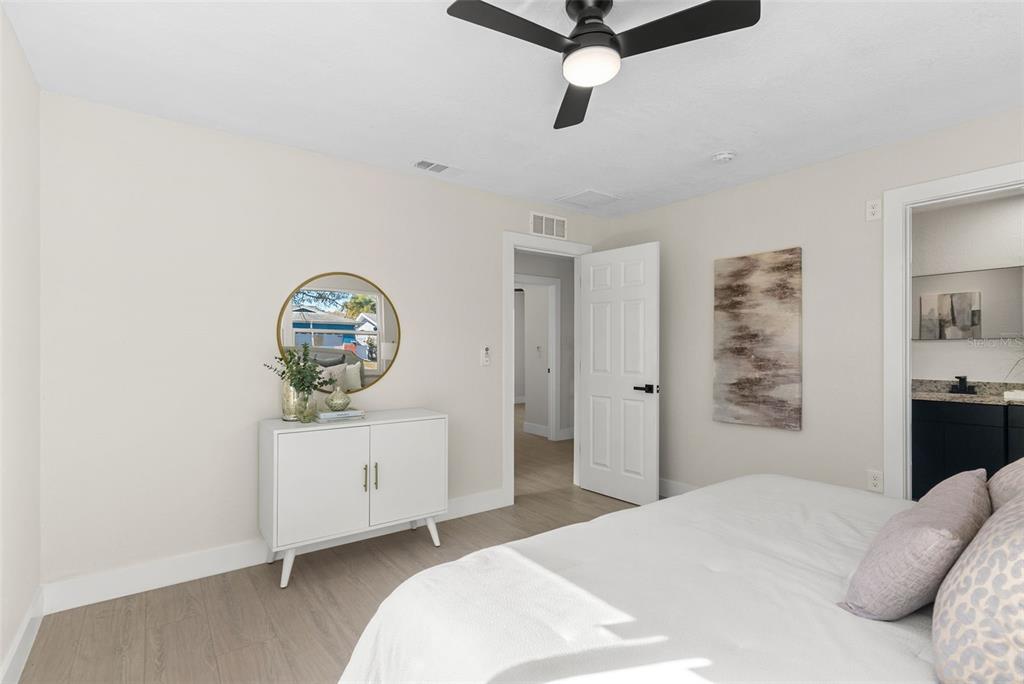 12368 70th Street Largo, FL 33773 - Photo 22 of 33 a bedroom with a bed and a dresser