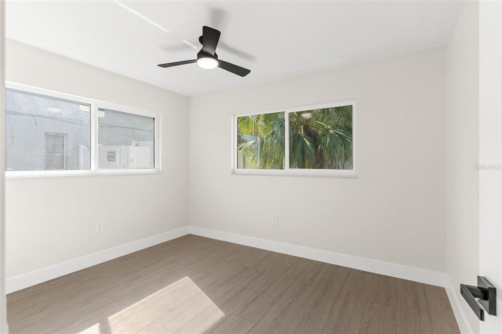 12368 70th Street Largo, FL 33773 - Photo 24 of 33 a view of empty room with wooden floor