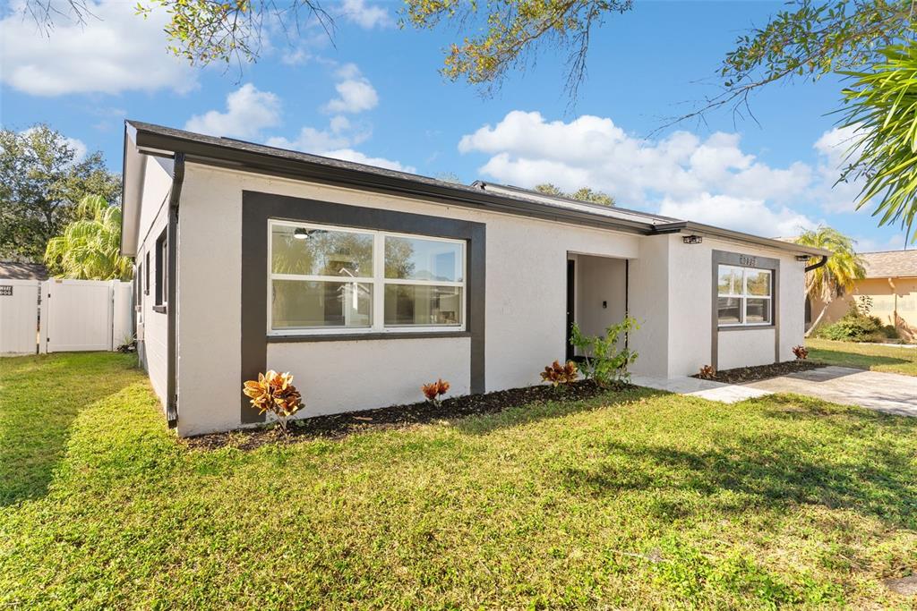 12368 70th Street Largo, FL 33773 - Photo 3 of 33 a view of a house with backyard and garden