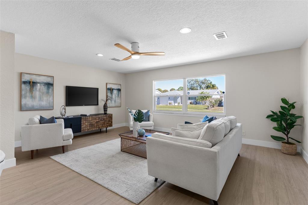 12368 70th Street Largo, FL 33773 - Photo 6 of 33 a living room with furniture and a flat screen tv